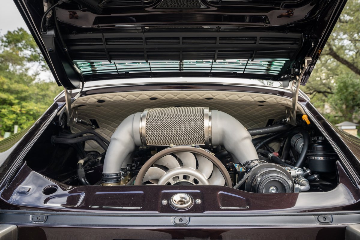 Aubergine metallic 1990 Singer 911 engine bay with quilted trim and turbocharger.