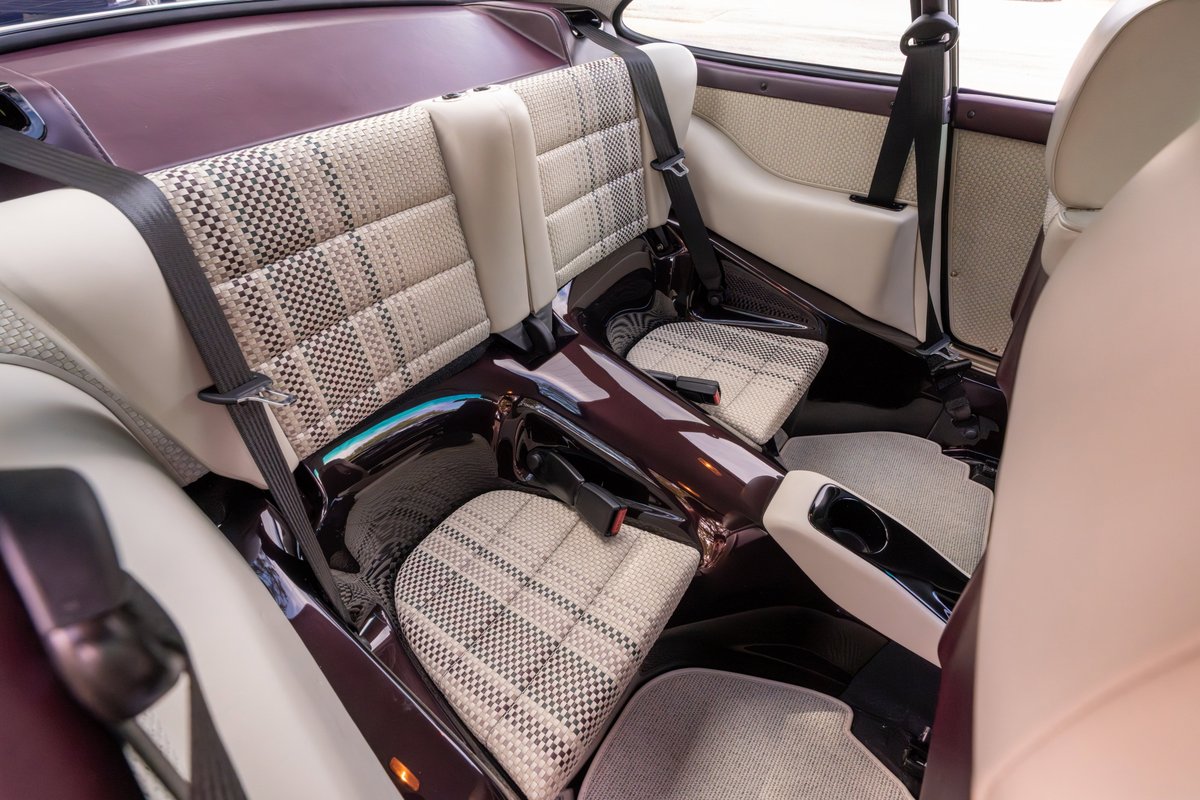 1990 Singer 911 aubergine metallic interior with houndstooth & cream plaid trim.