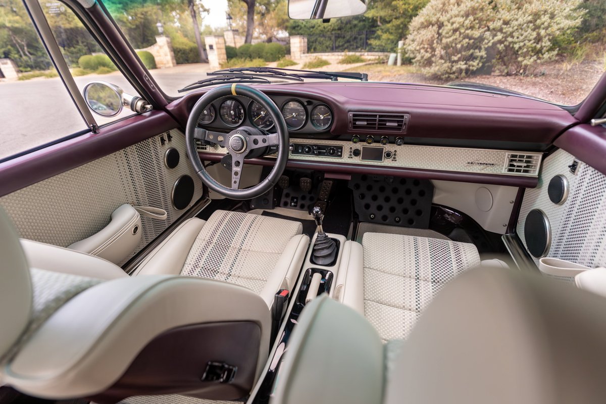 Aubergine Metallic 1990 Singer 911 interior: houndstooth seats, leather trim, rally steering wheel.