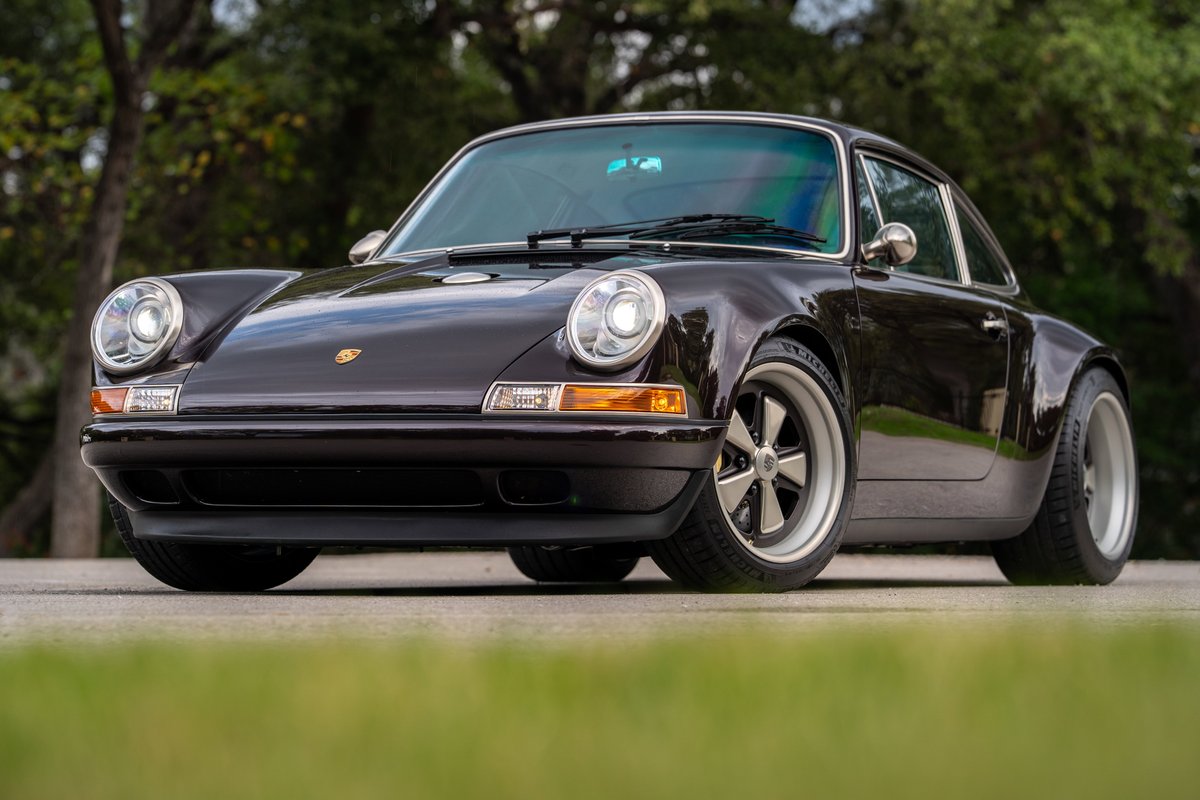 Aubergine Metallic 1990 Singer Porsche 911 with classic five-spoke rims.
