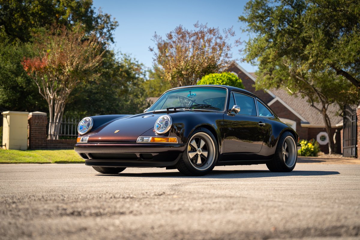Aubergine Metallic 1990 Singer Porsche 911 with classic Fuchs rims.