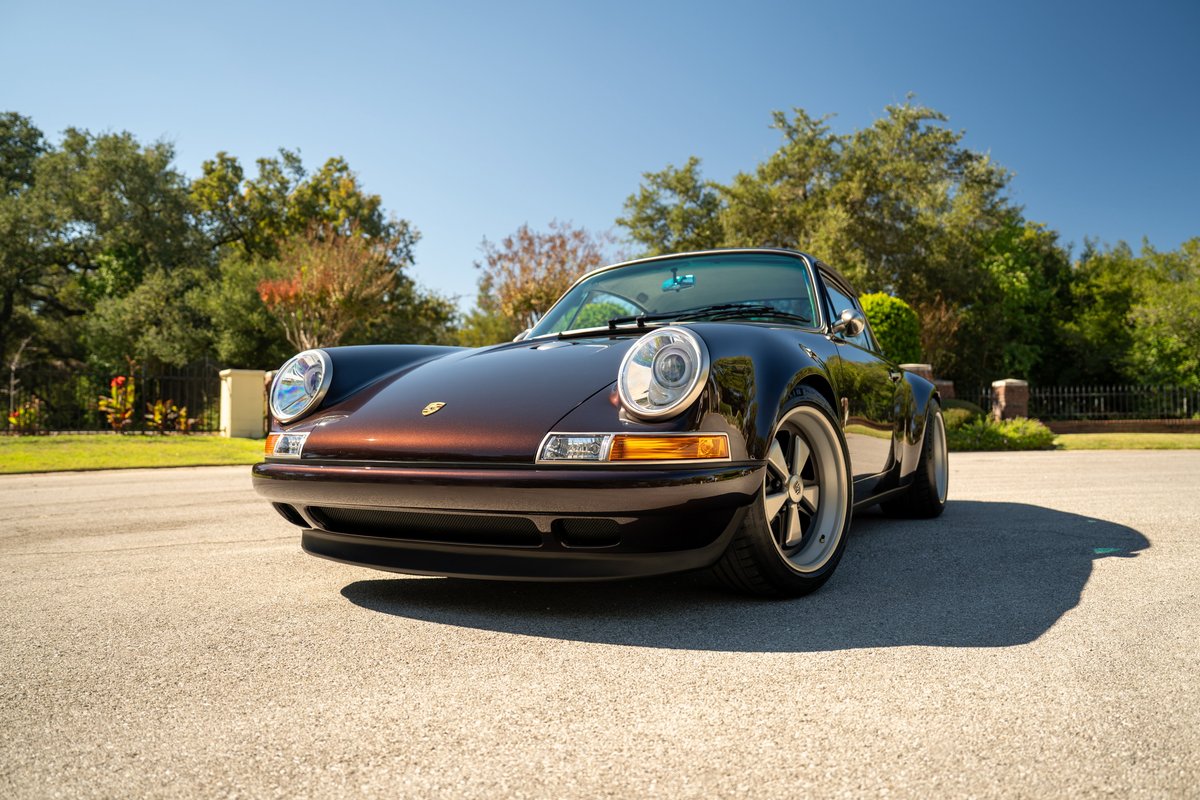 Aubergine Metallic Singer 911 with Fuchs-style rims and chrome trim.
