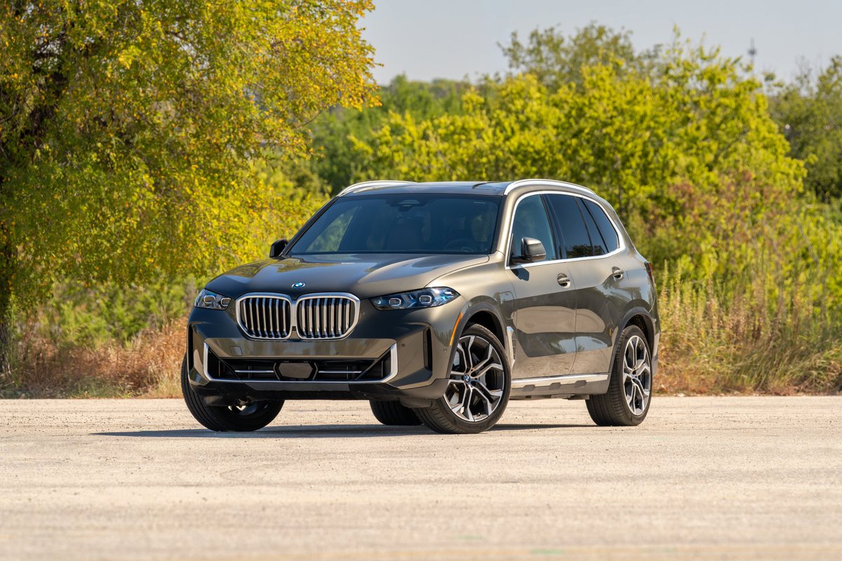 2026 BMW X5 in Manhattan Green metallic with multi-spoke rims and silver trim.