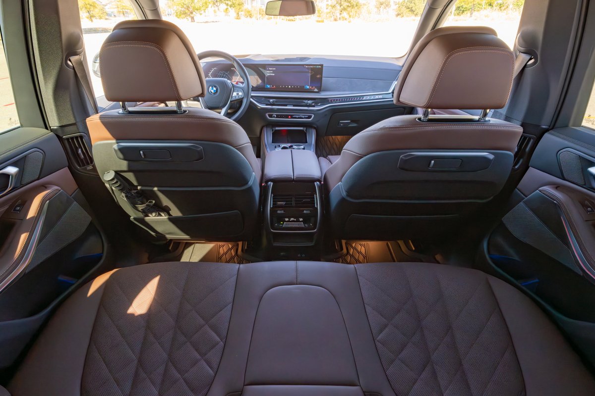 Interior view of a 2026 BMW X5 with diamond-stitched brown leather seats and premium trim.