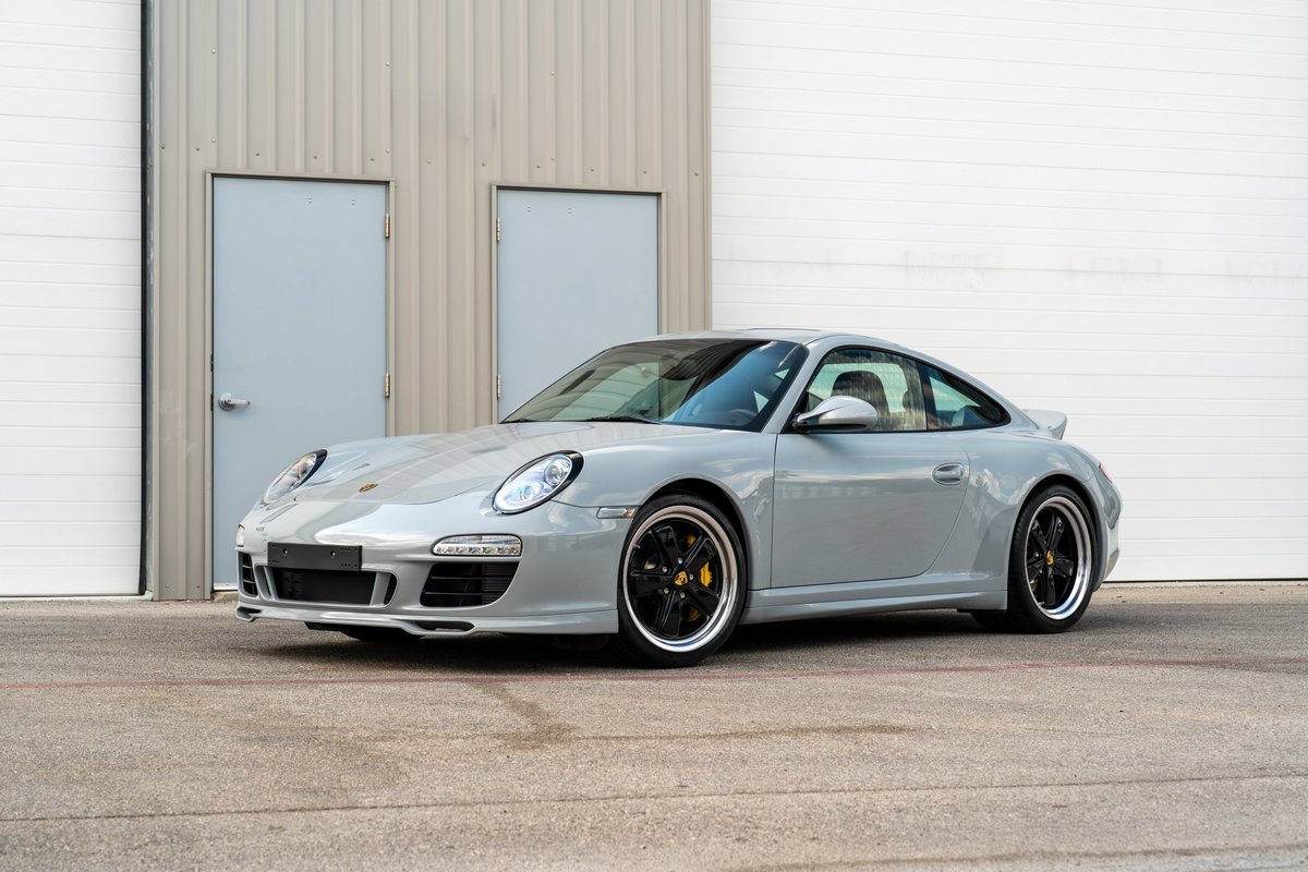 2010 Porsche 911 Sport Classic in Sport Classic Grey with black alloy rims and yellow brake calipers.