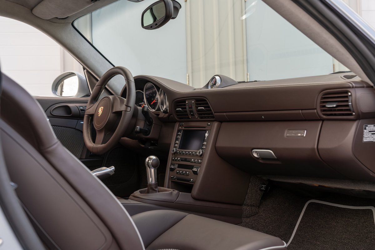 2010 Porsche 911 Sport Classic interior. Dark brown leather seats and dash trim.