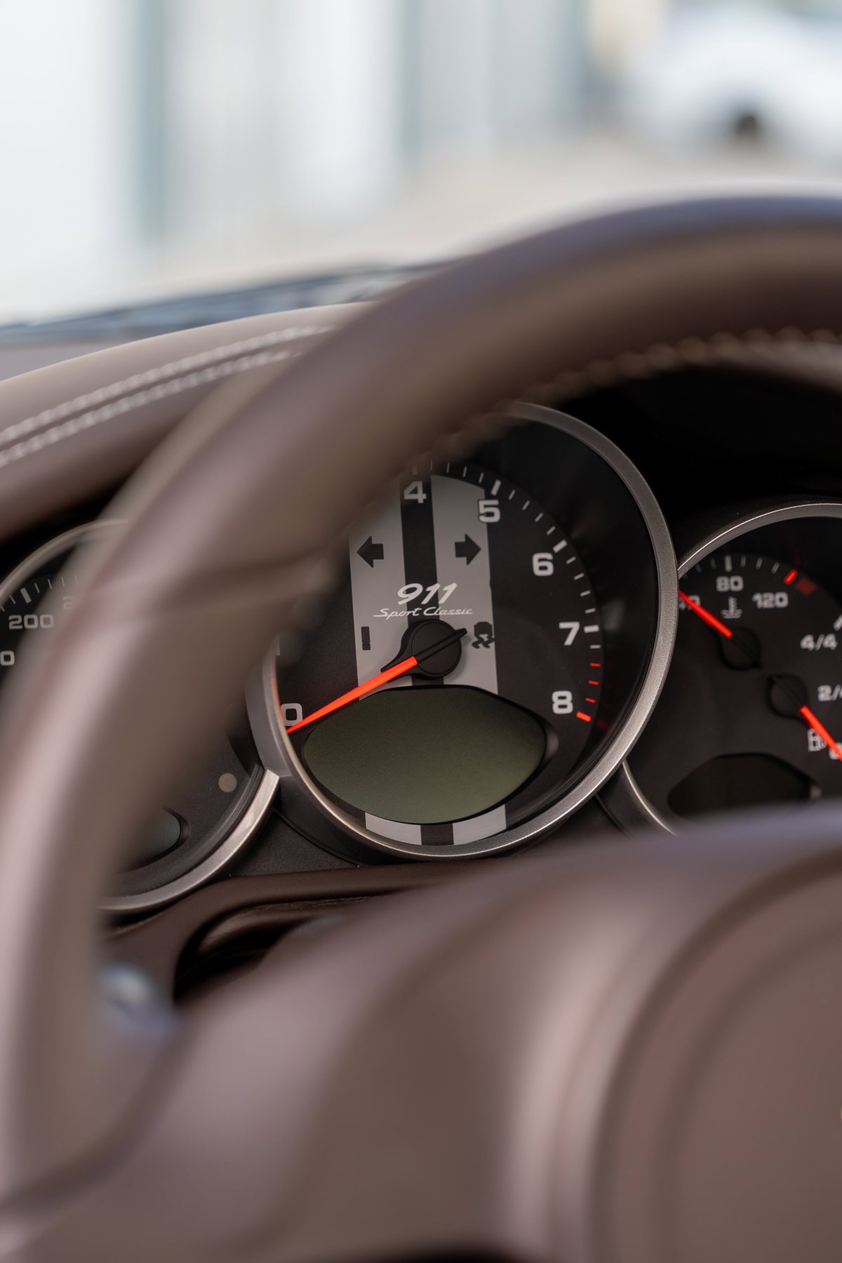 Close-up of the instrument cluster in a 2010 Porsche 911 Sport Classic.