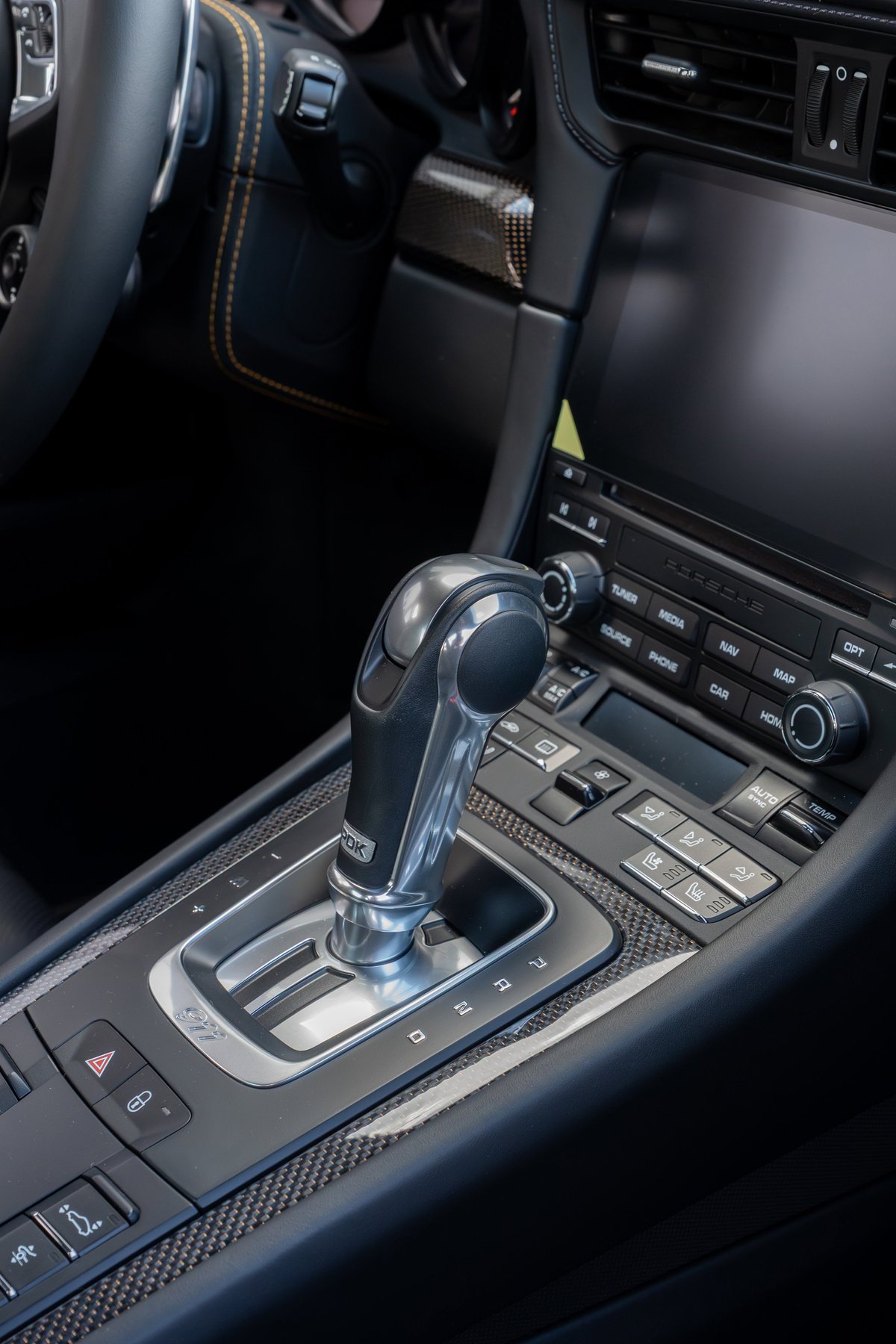 2018 Porsche 911 Turbo S Exclusive Series gear selector and carbon fiber trim.