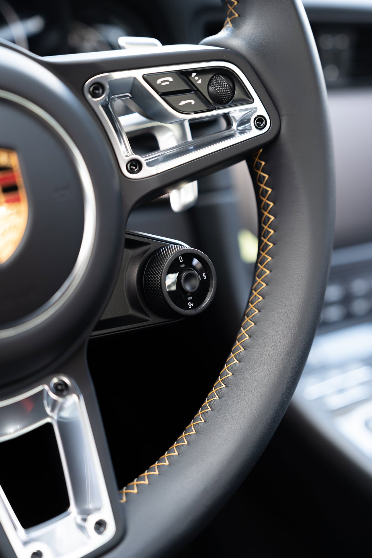 2018 Porsche 911 Turbo S steering wheel with yellow contrast stitching & drive mode selector.