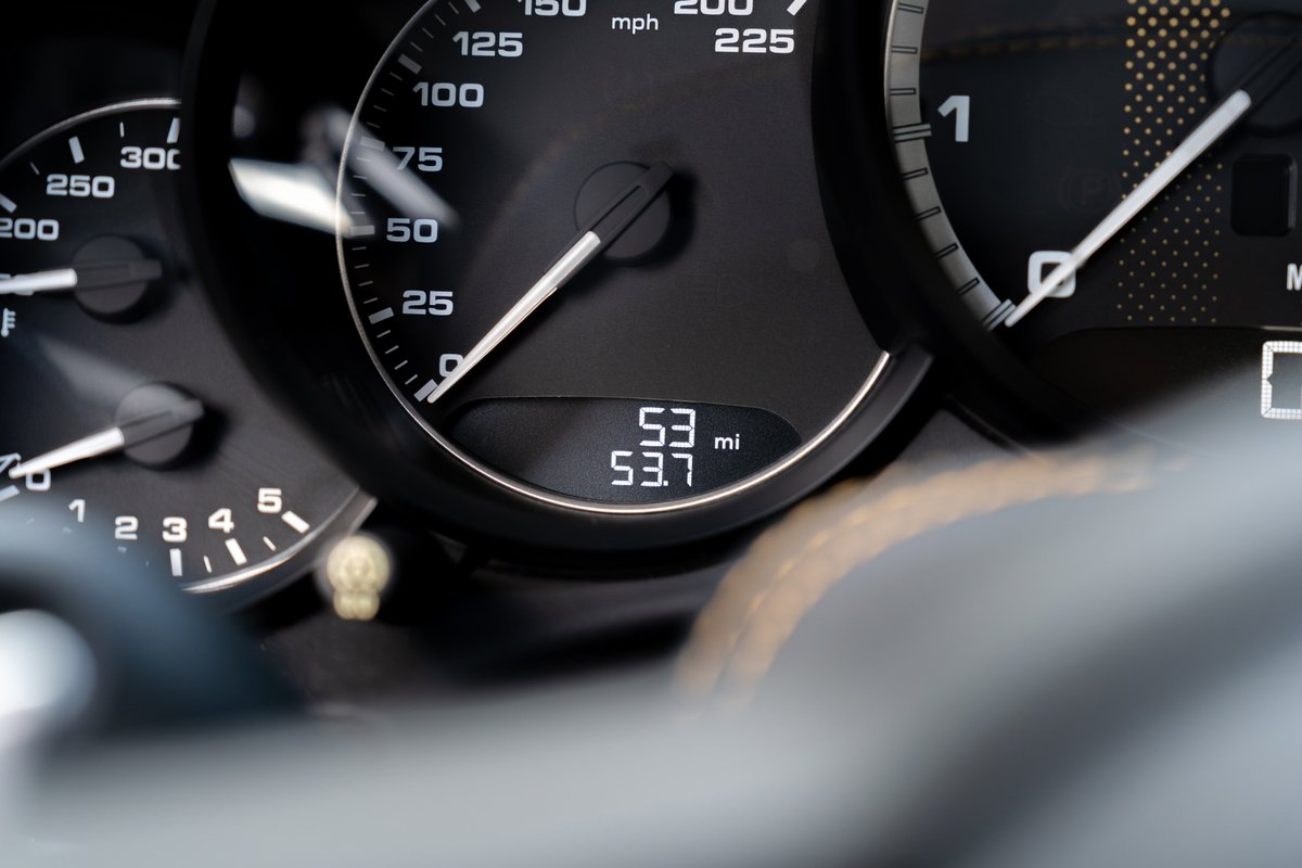Close-up on the instrument cluster of a 2018 Porsche 911 Turbo S Exclusive Series, showing 53 miles.
