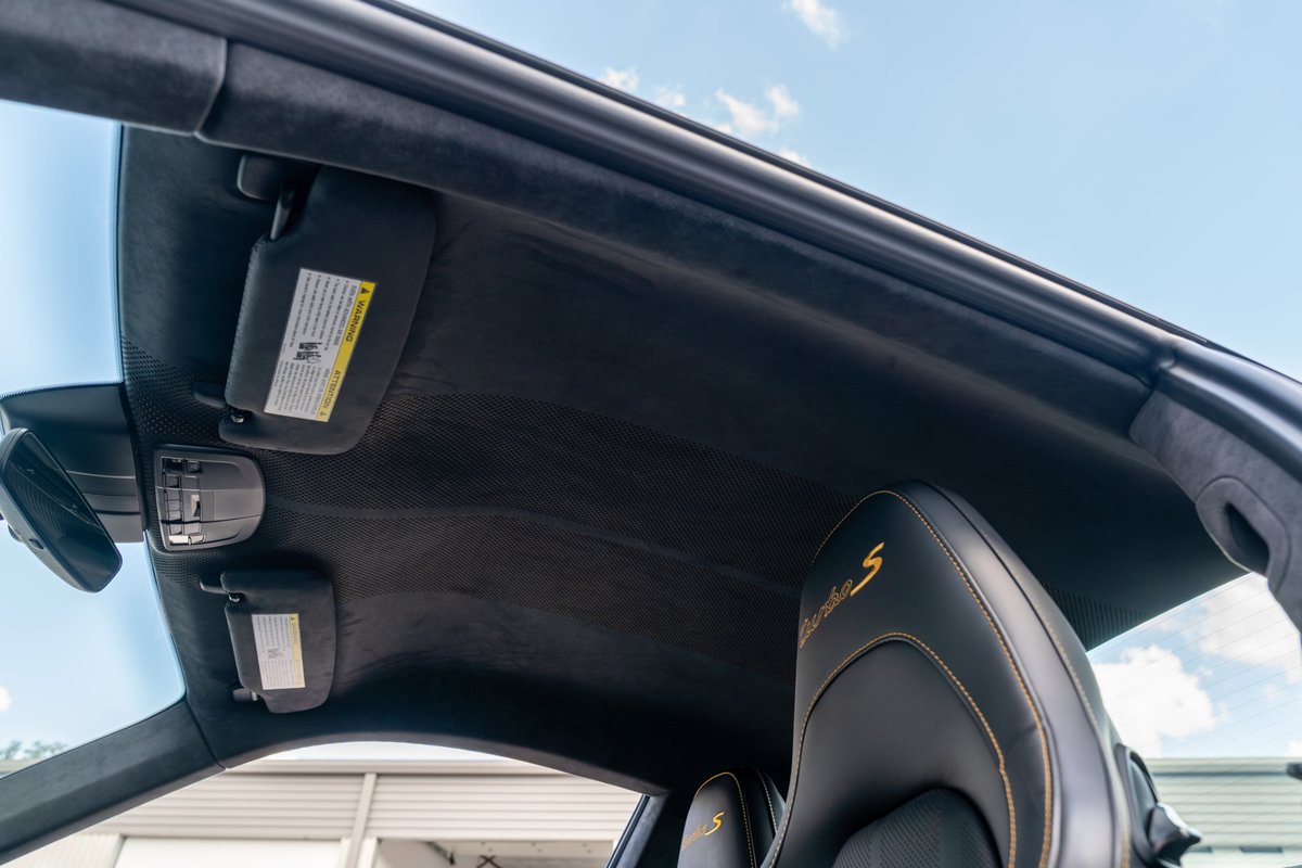 Interior of a 2018 Porsche 911 Turbo S Exclusive Series with Alcantara headliner and embroidered seats.