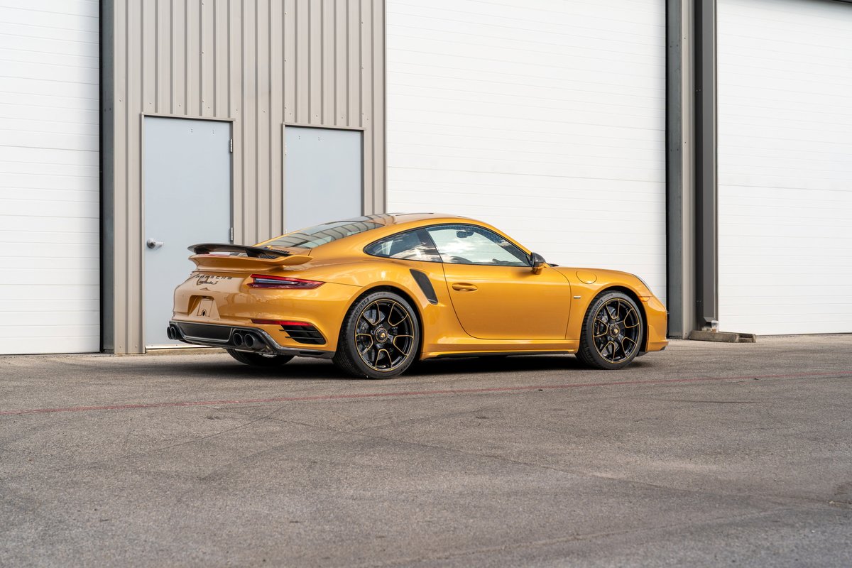 Gold 2018 Porsche 911 Turbo S Exclusive Series with black center-lock rims.
