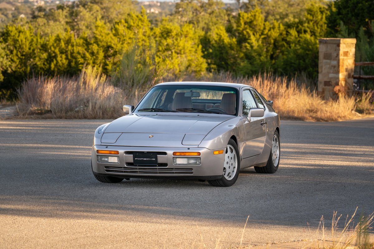 Silver 1987 Porsche 944 Turbo S with Fuchs rims and silver trim, front 3/4 view.