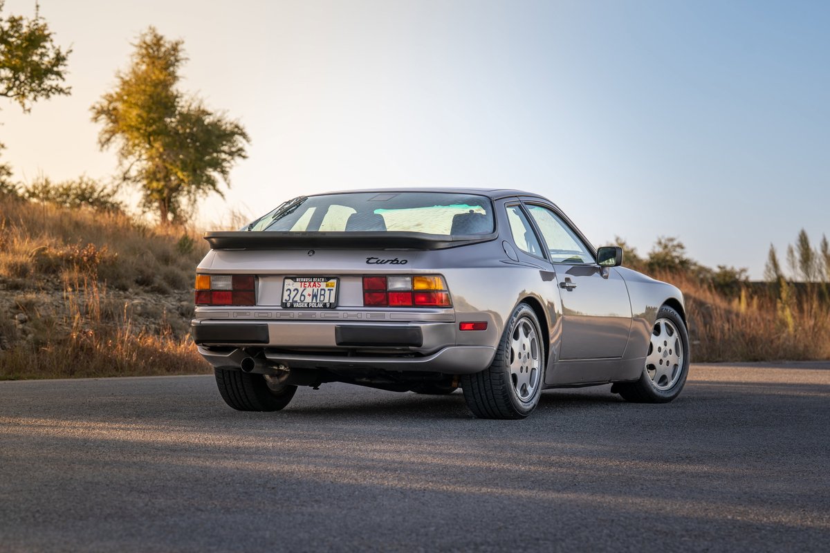 1987 Porsche 944 Turbo S in silver, with Turbo badging and classic five-spoke rims.