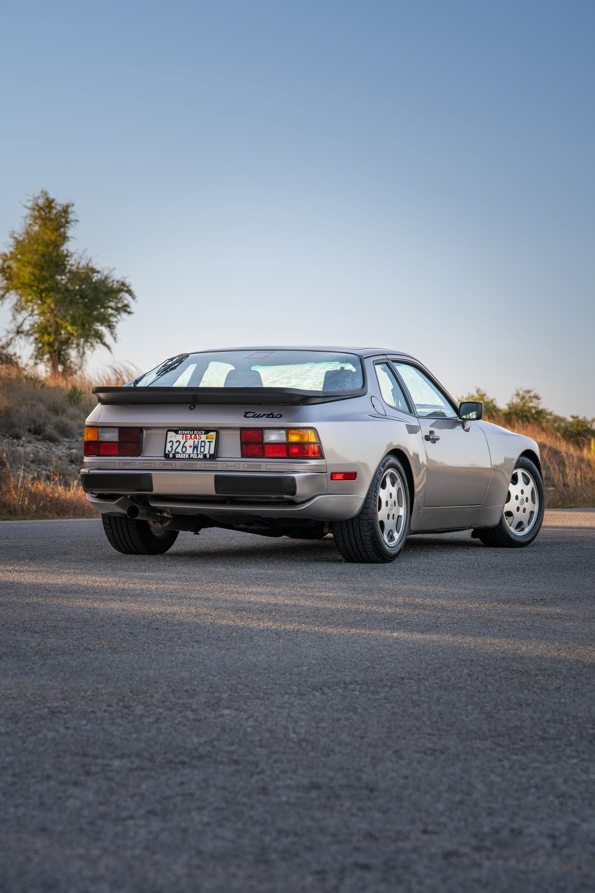 Rear view of a silver 1987 Porsche 944 Turbo S with silver alloy rims.