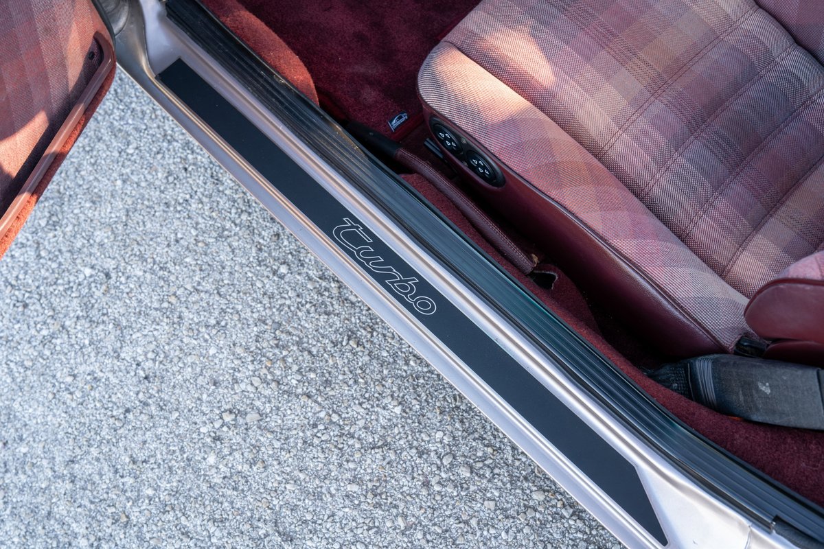 1987 Porsche 944 Turbo S silver door sill trim with "Turbo" script.