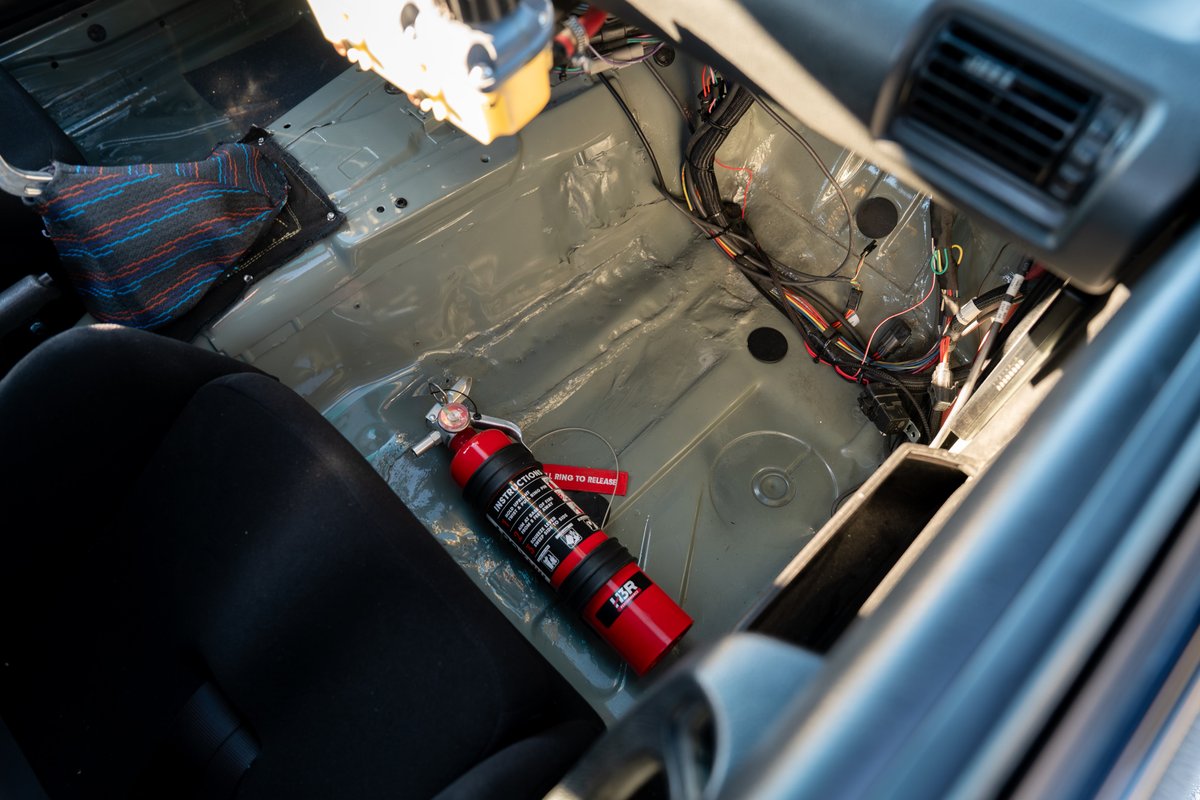 1989 BMW 325is interior, gutted with racing seats and fire extinguisher.