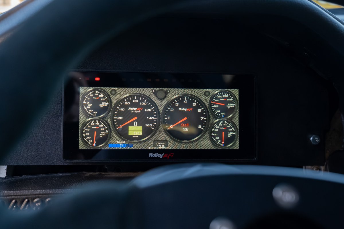 1989 BMW 325is LS1 digital dash with multiple gauges and Holley EFI branding.