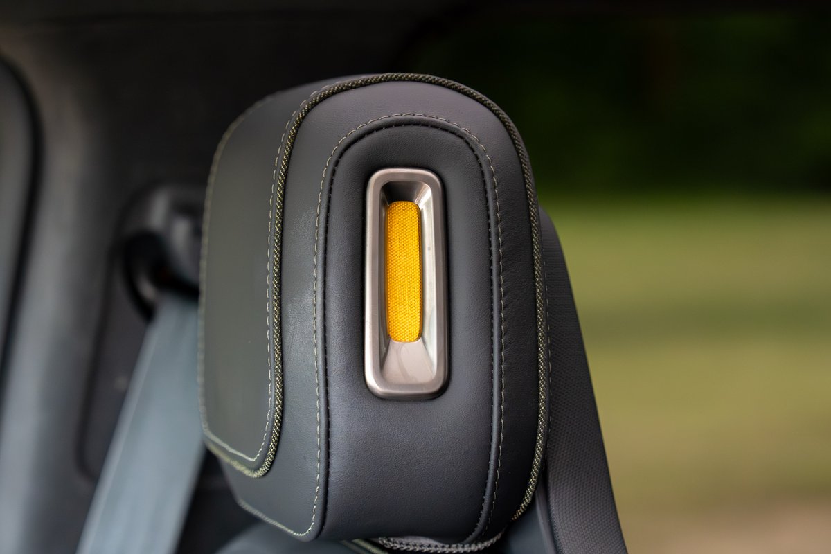 2022 Rivian R1T driver's seat headrest with yellow accent and silver trim.
