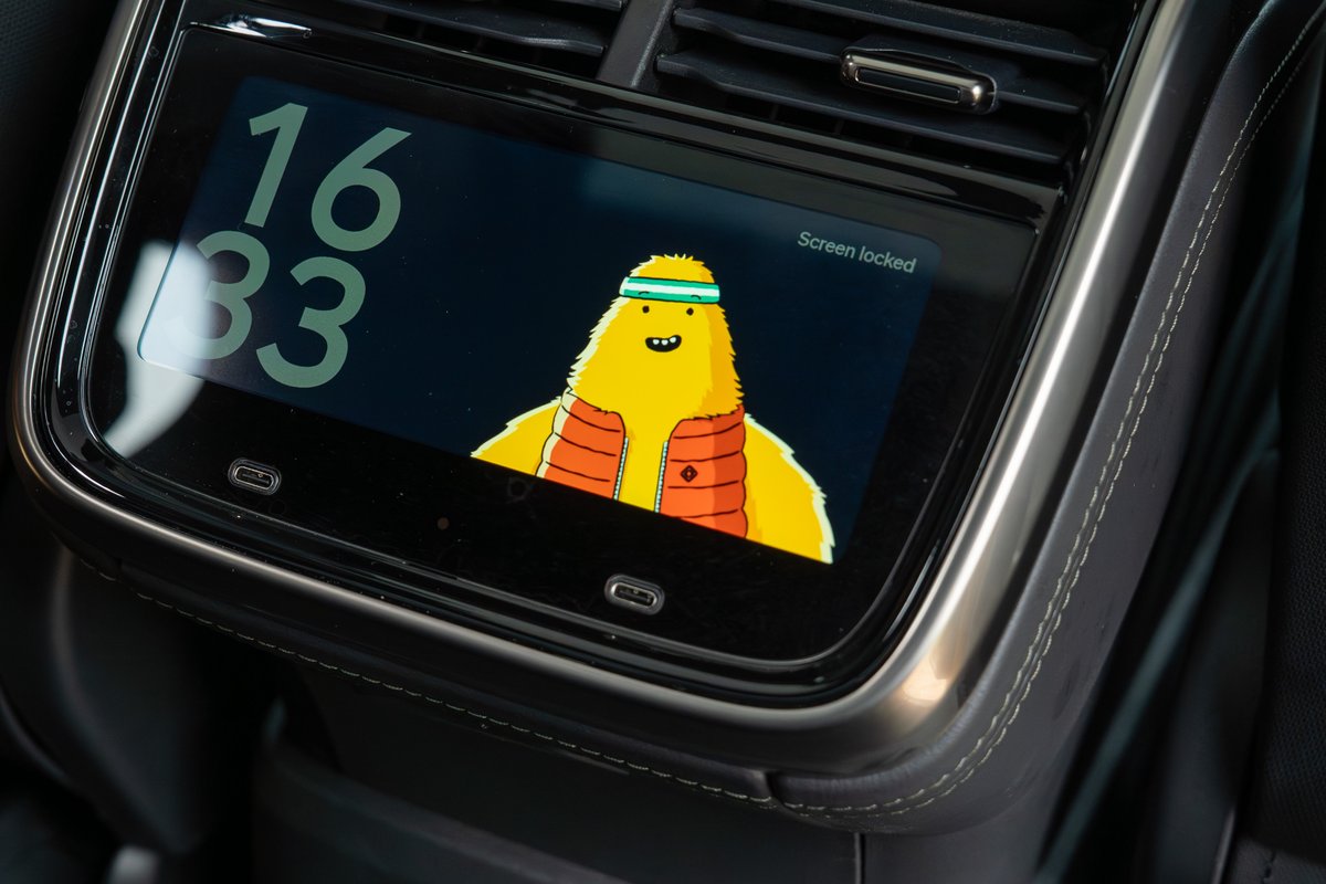 Close-up of a yellow Rivian R1T's rear seat screen showing a cartoon character.