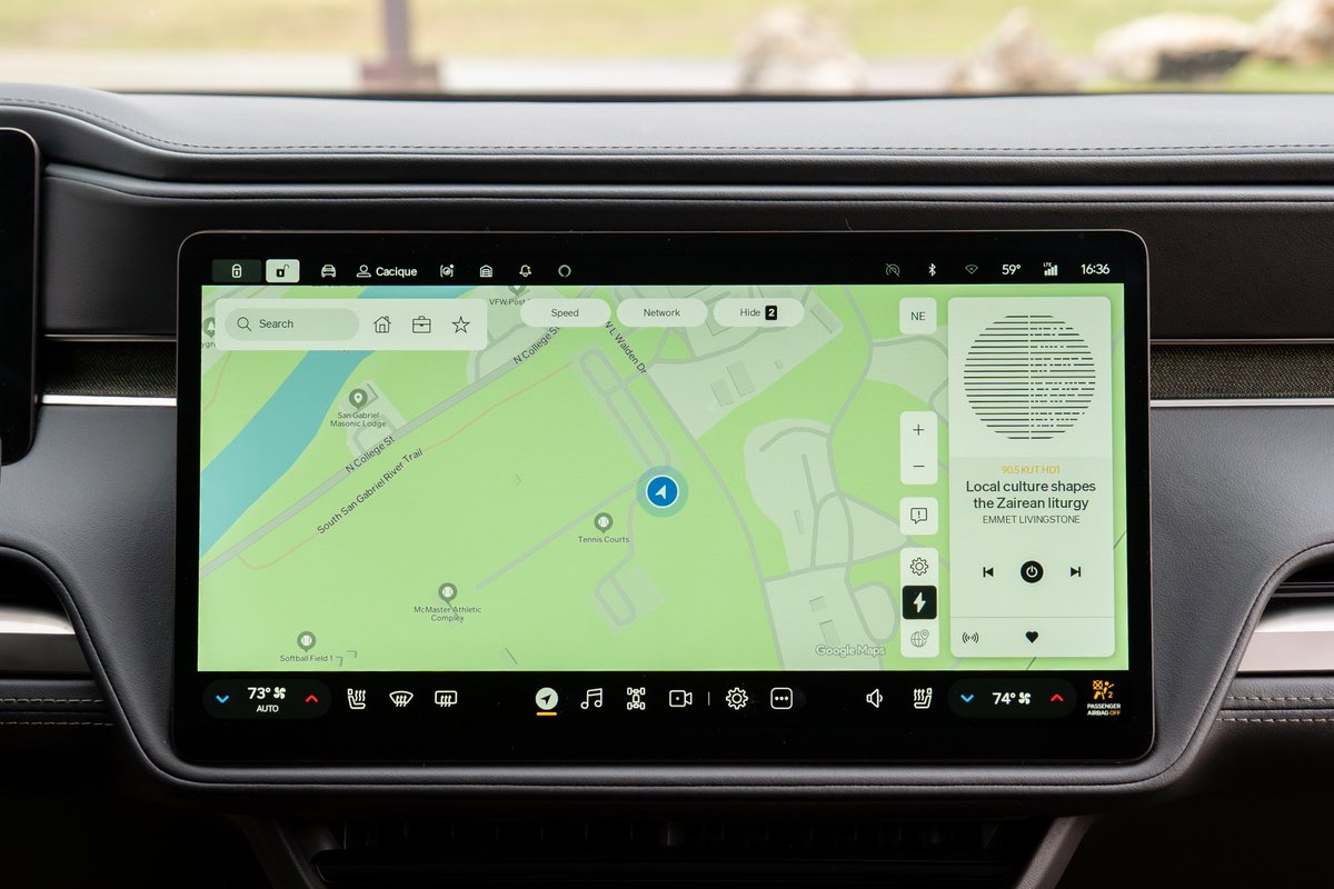 Yellow 2022 Rivian R1T infotainment screen displays navigation and audio information.