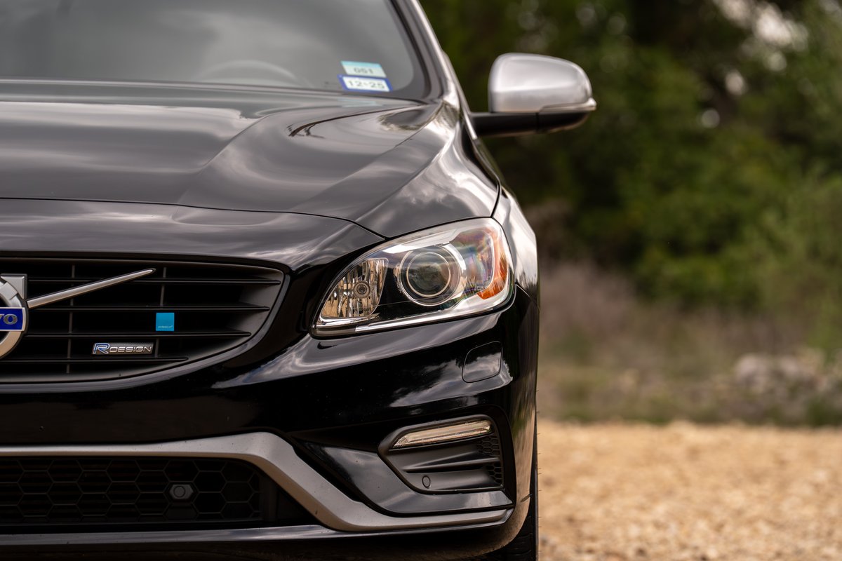 Front view of a black 2015 Volvo V60 R-Design Polestar with unique grille badging and headlights.