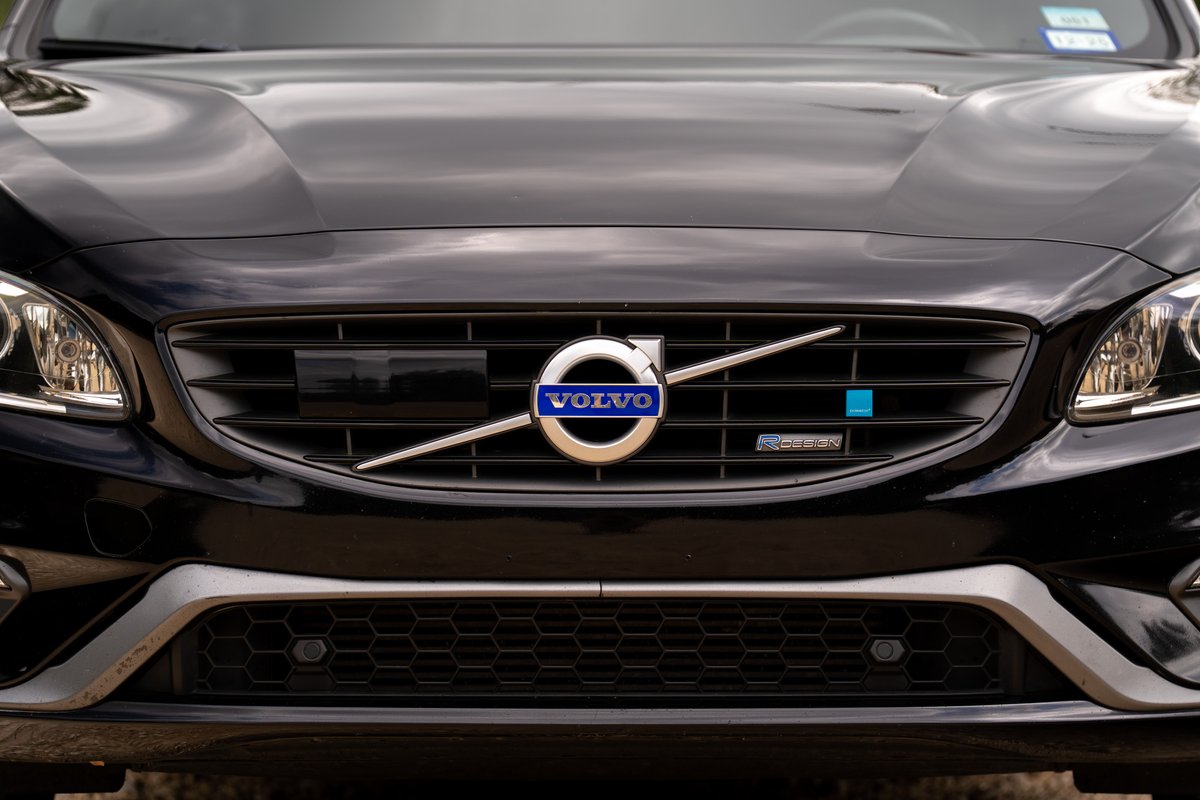 Front view of a black 2015 Volvo V60 R-Design Polestar, showing the grille and headlights.
