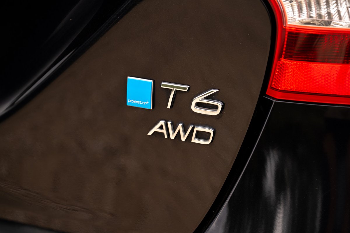 2015 Volvo V60 Polestar T6 AWD badge on black paint.