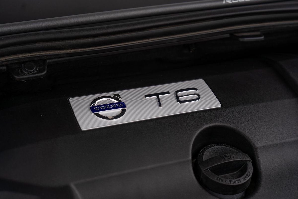 Volvo V60 T6 Polestar engine bay badge with carbon fiber trim.