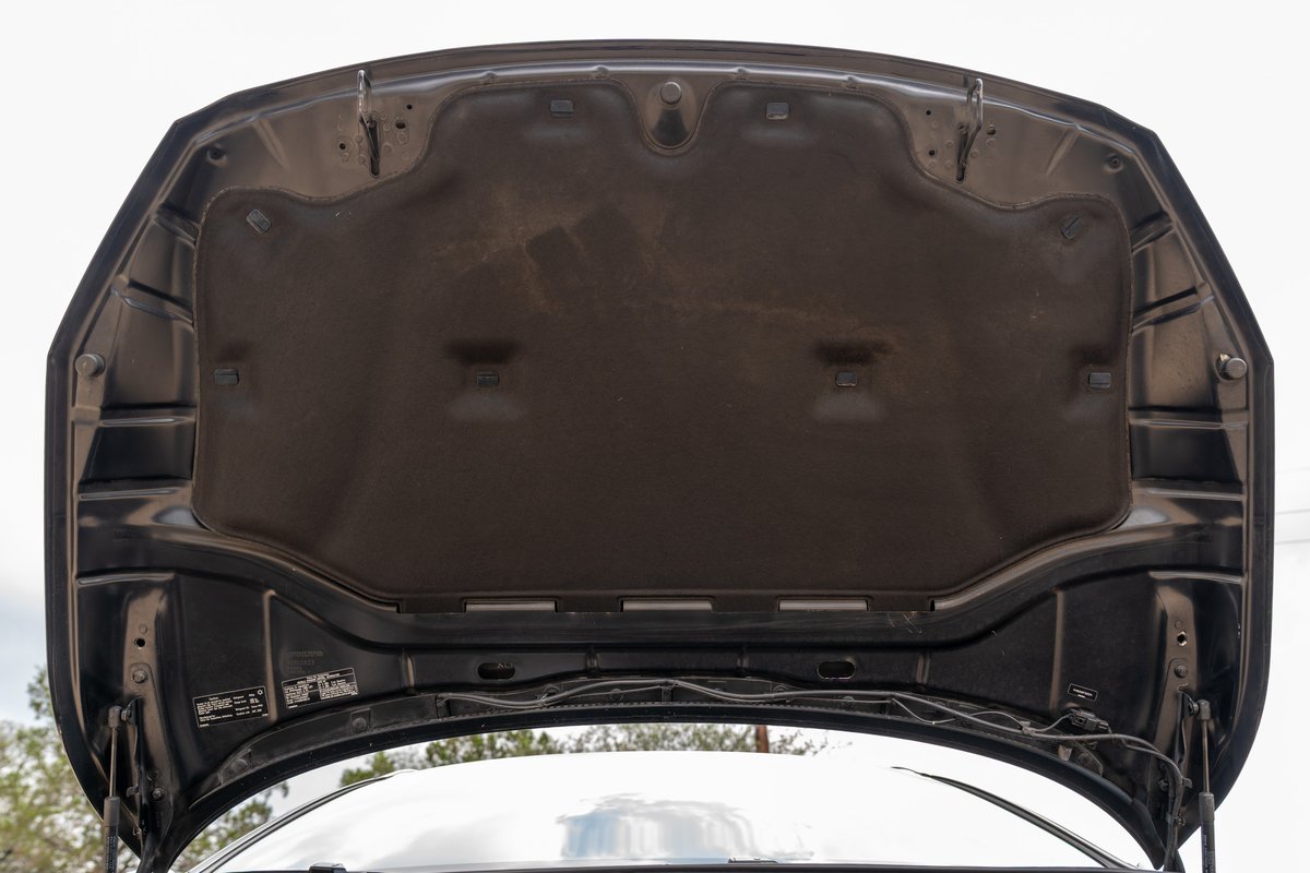 Underhood insulation of a black 2015 Volvo V60 R-Design Polestar.