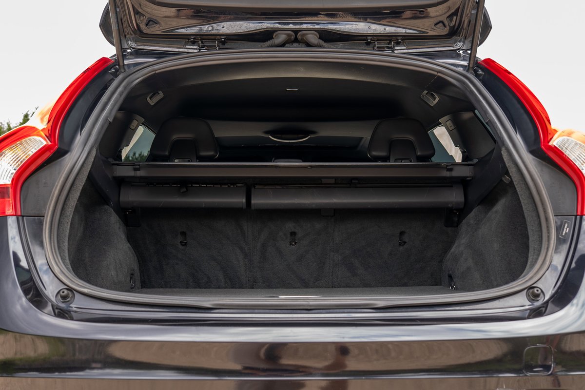2015 Volvo V60 R-Design Polestar wagon rear cargo area with open tailgate.
