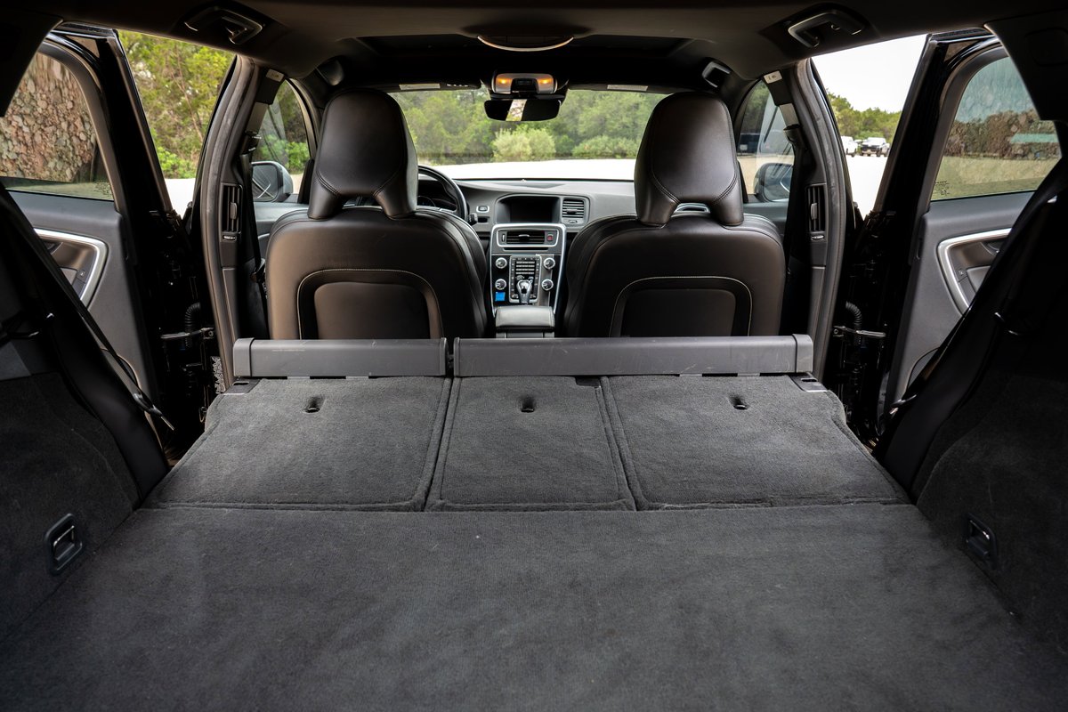 2015 Volvo V60 R-Design Polestar interior with folded rear seats and cargo space.