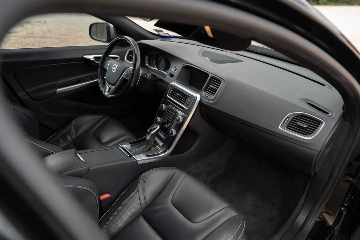 2015 Volvo V60 R-Design Polestar interior. Black leather seats, dashboard, center console.