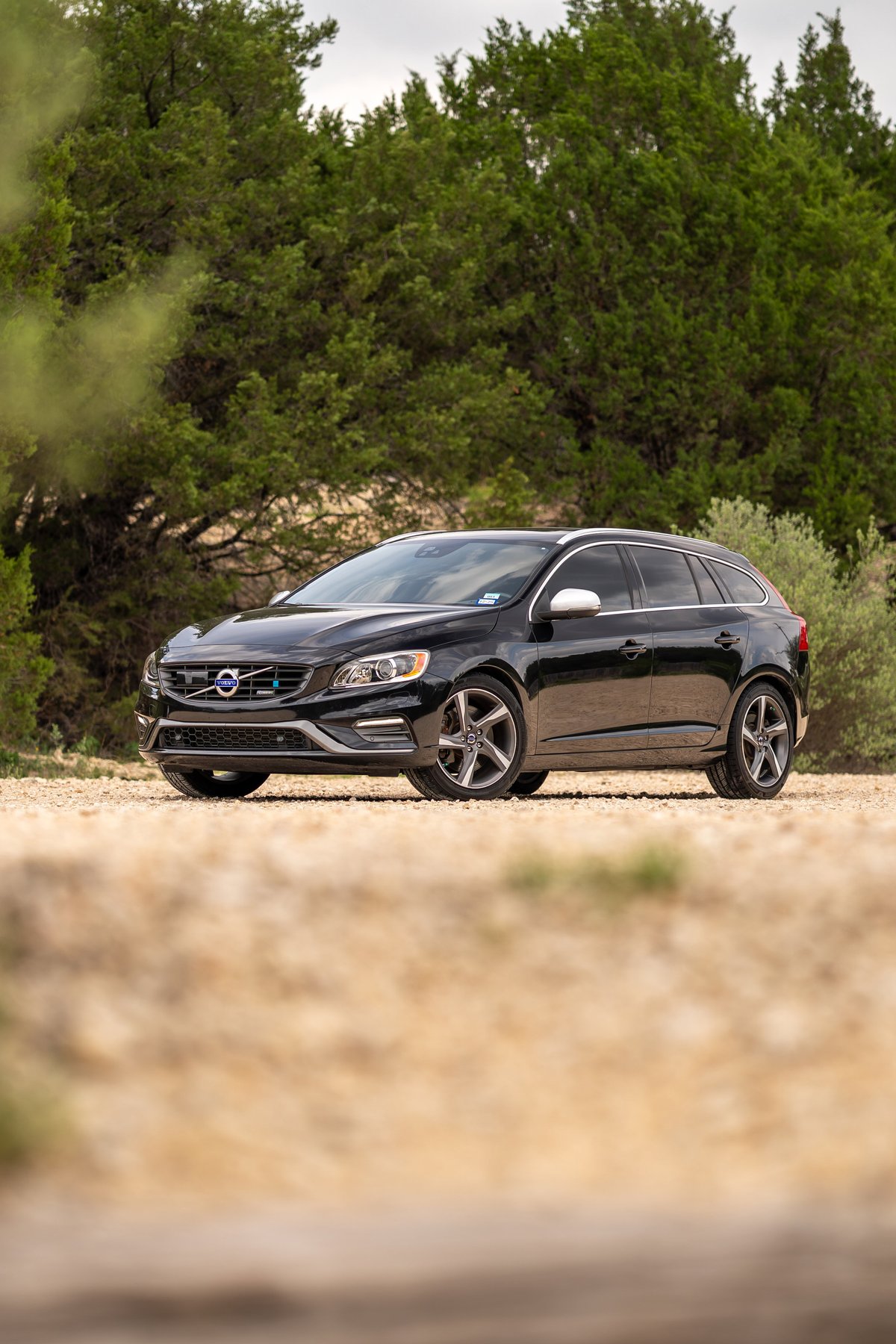 Black 2015 Volvo V60 R-Design Polestar wagon with silver trim and five-spoke rims.