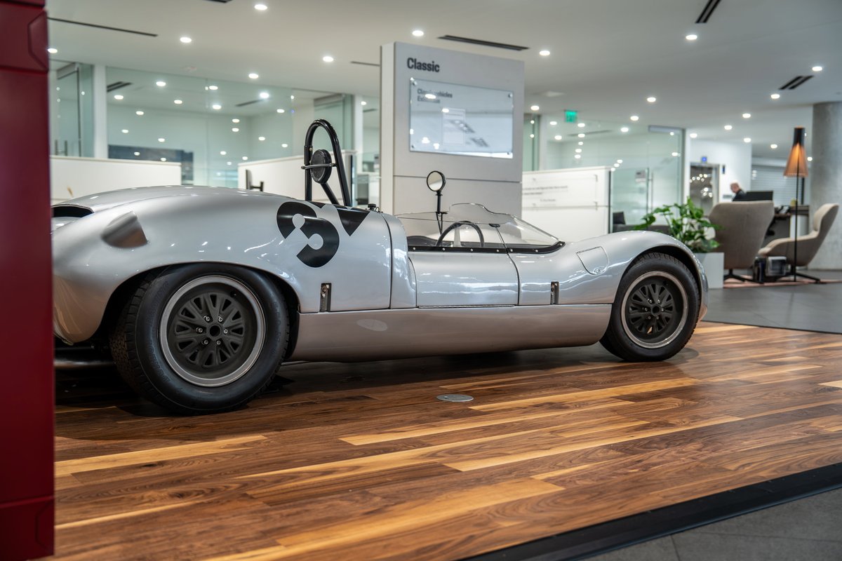 1964 Elva Porsche 4-Cam silver race car with black '35' livery and classic rims.