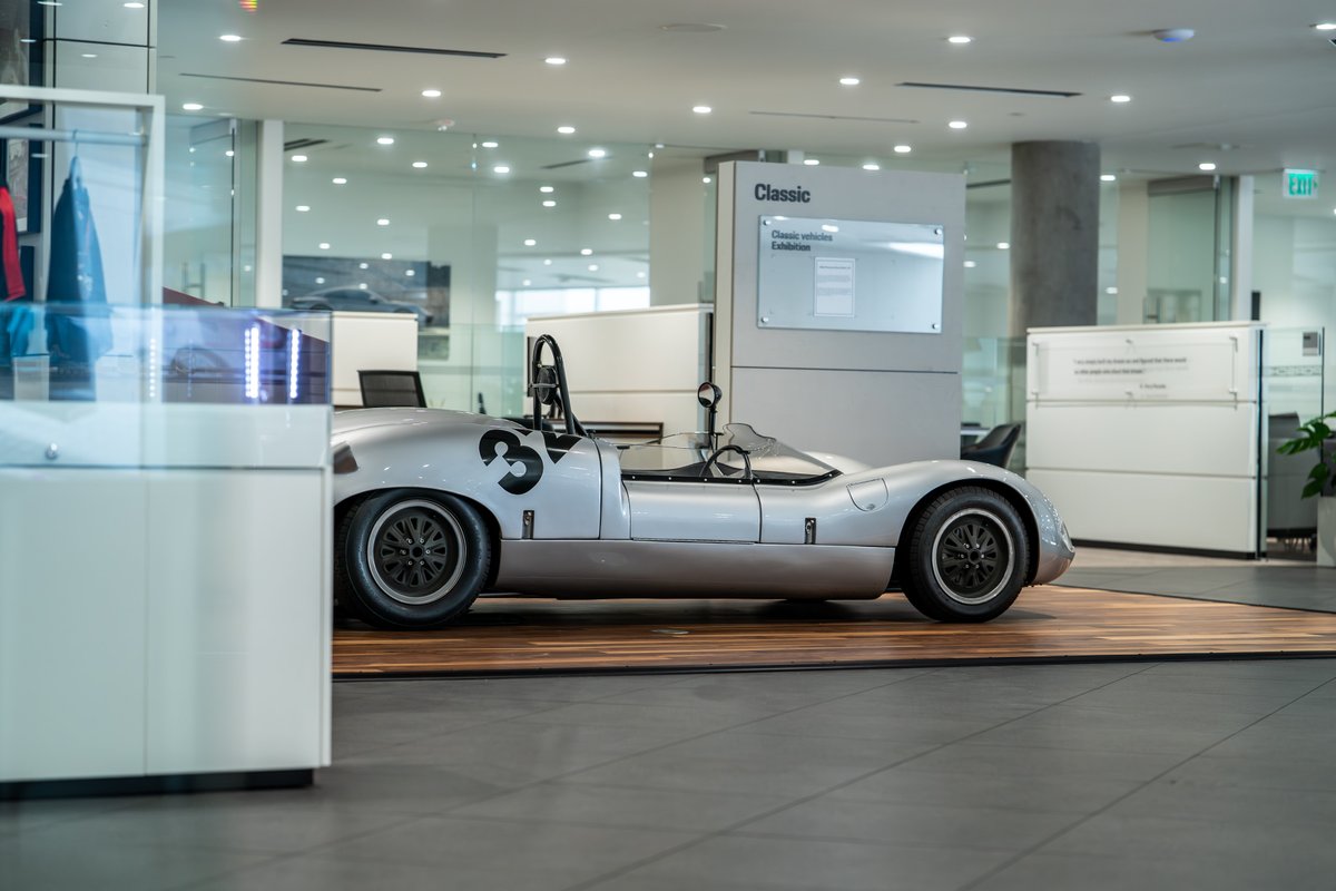 1964 Elva Porsche 4-Cam race car with black racing rims and side number 3 livery.