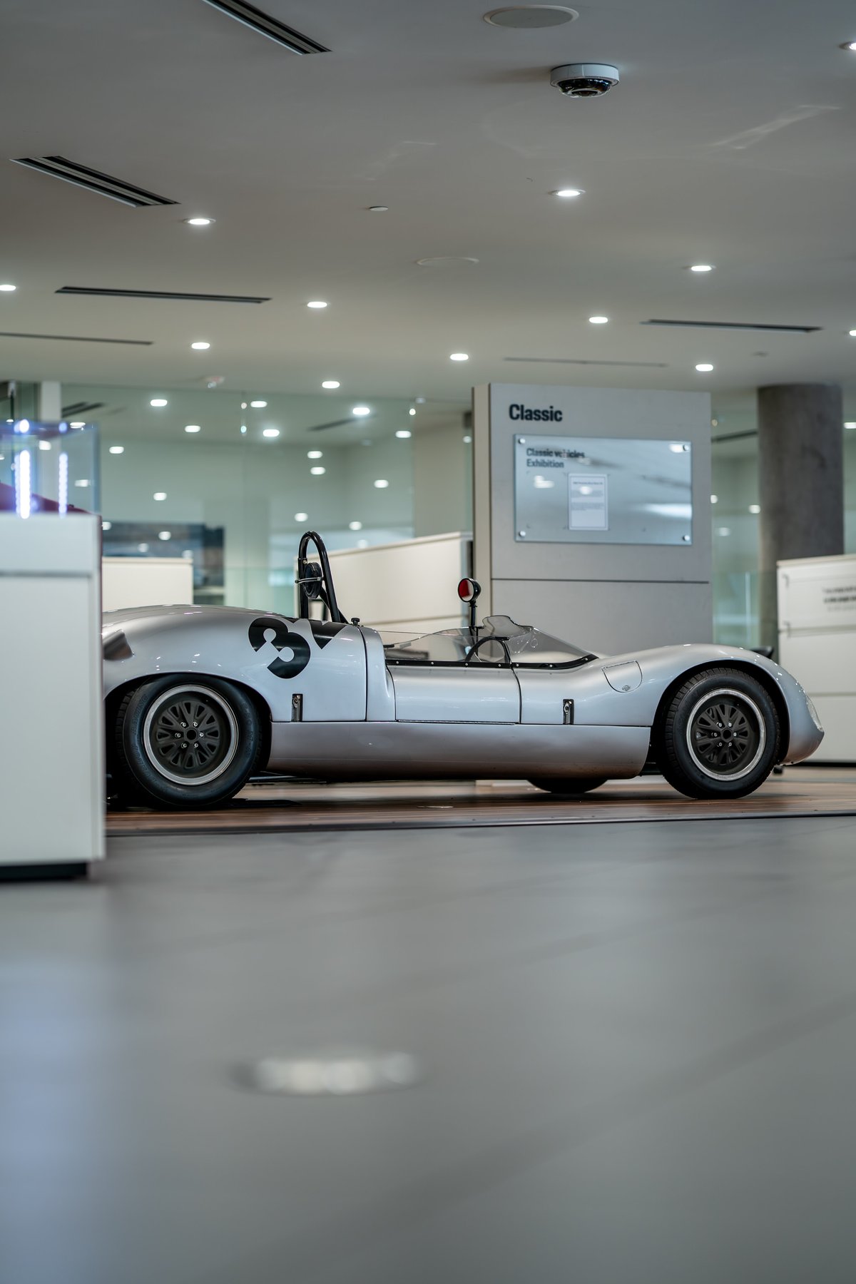 1964 Elva Porsche 4-cam race car, silver with black racing number '3' livery.
