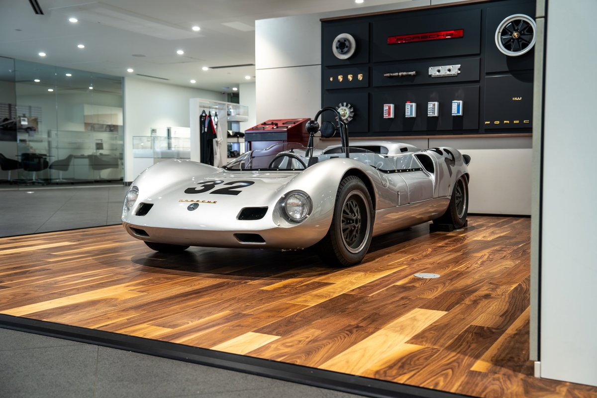 1964 Elva Porsche 4-Cam race car, silver livery with "32" on the front.