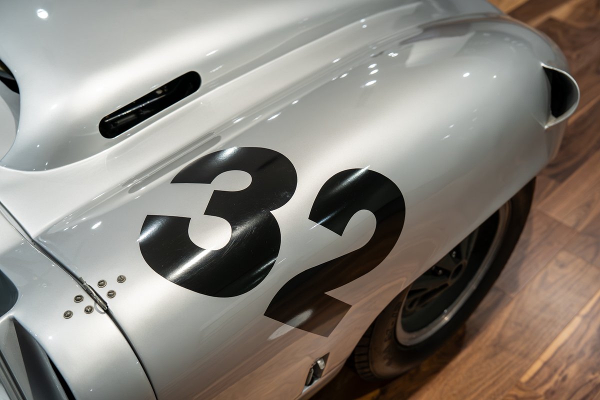 Silver 1964 Elva Porsche 4-Cam with black racing livery number 32 on fender.