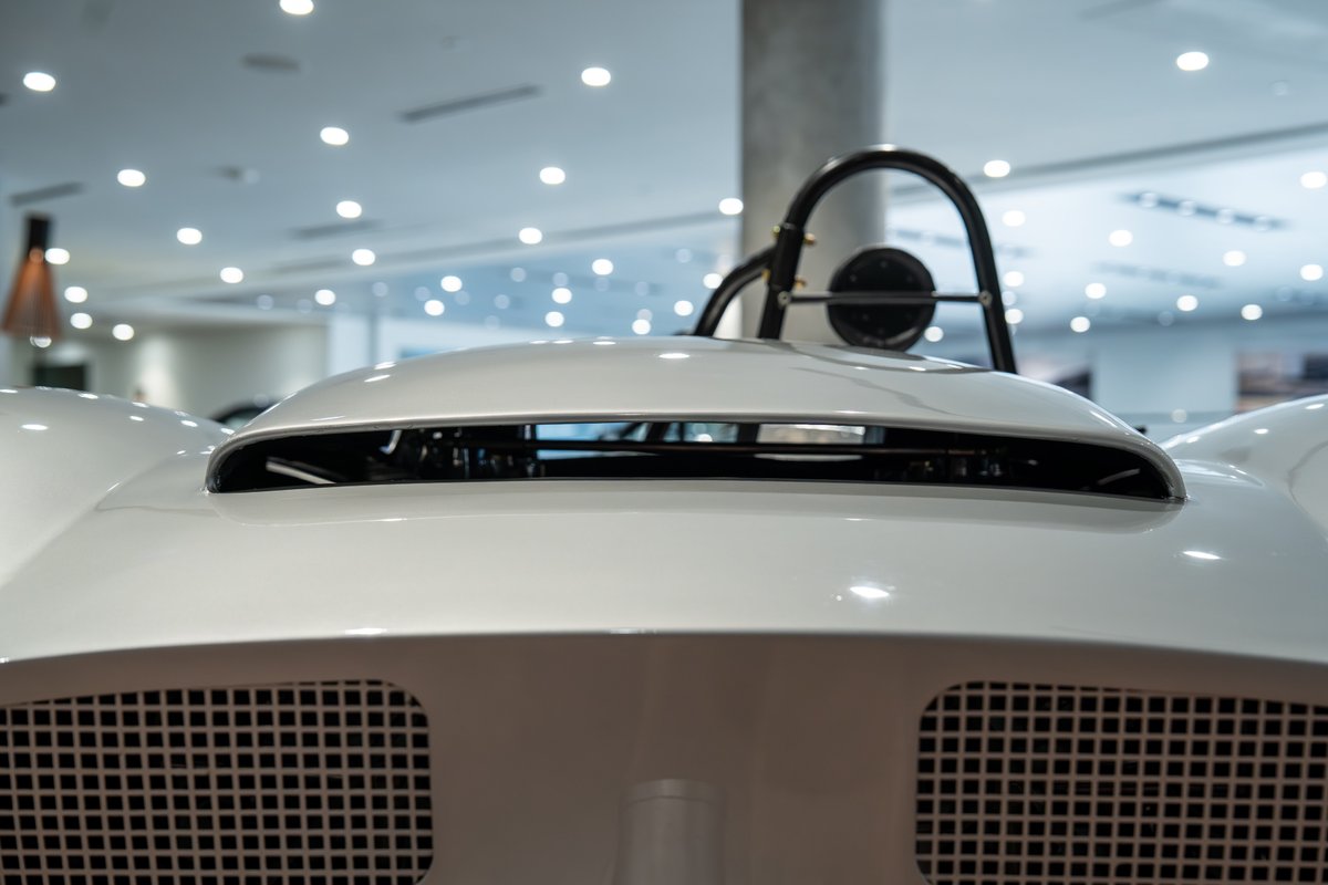 Close-up of a white 1964 Elva Porsche 4-Cam's hood scoop and grille.