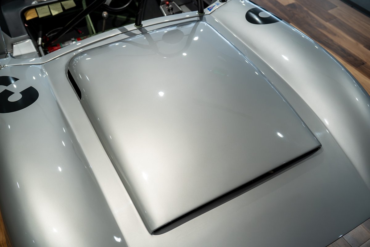Close-up of the silver 1964 Elva Porsche 4-Cam hood, showing racing livery number 3.