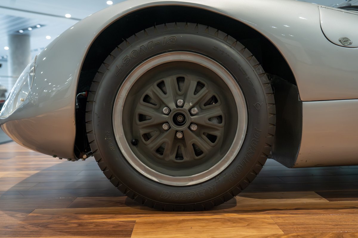 1964 Elva Porsche 4-Cam race car, silver, close-up of front wheel and fender.
