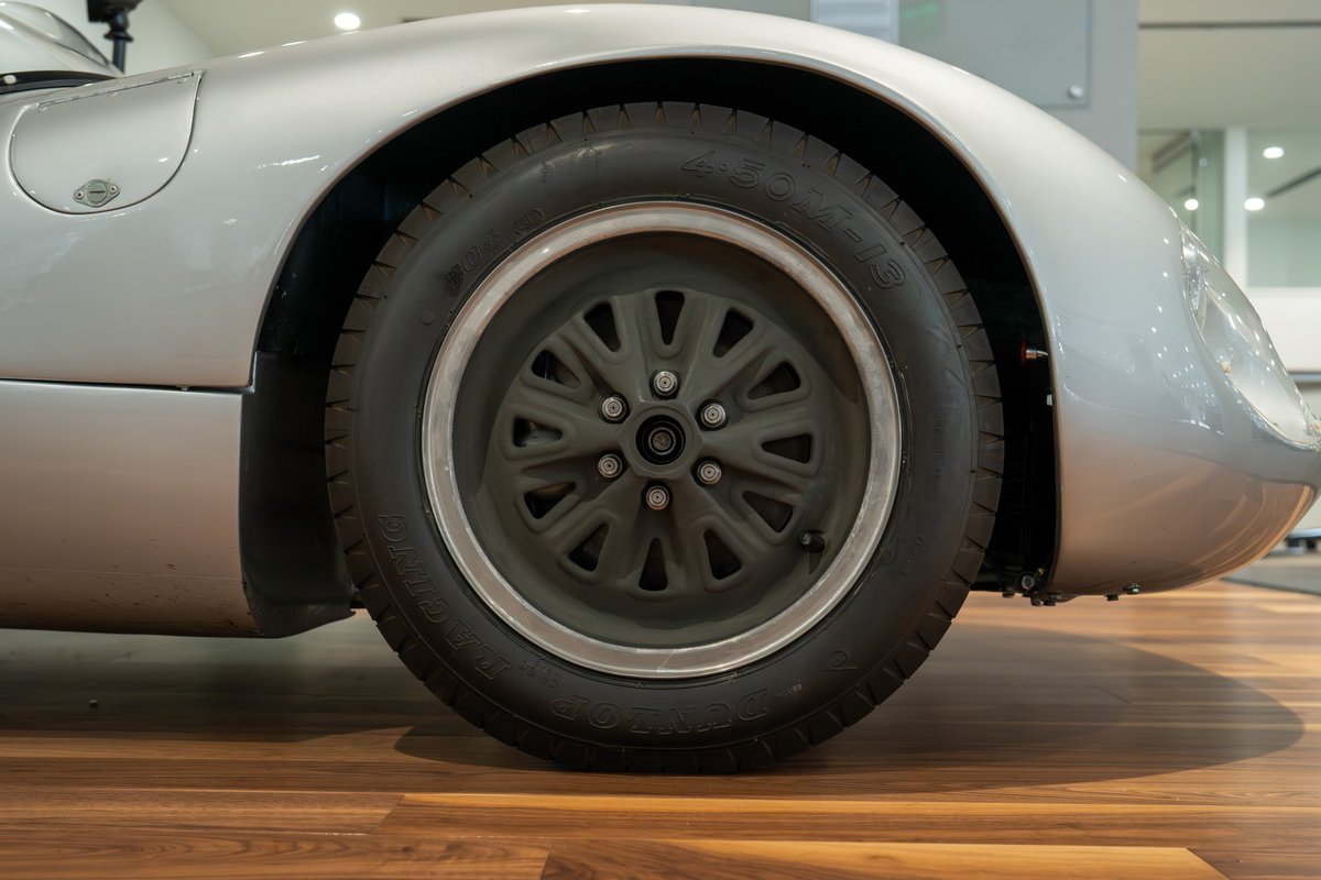 Silver 1964 Elva Porsche 4-Cam with classic multi-spoke rims.