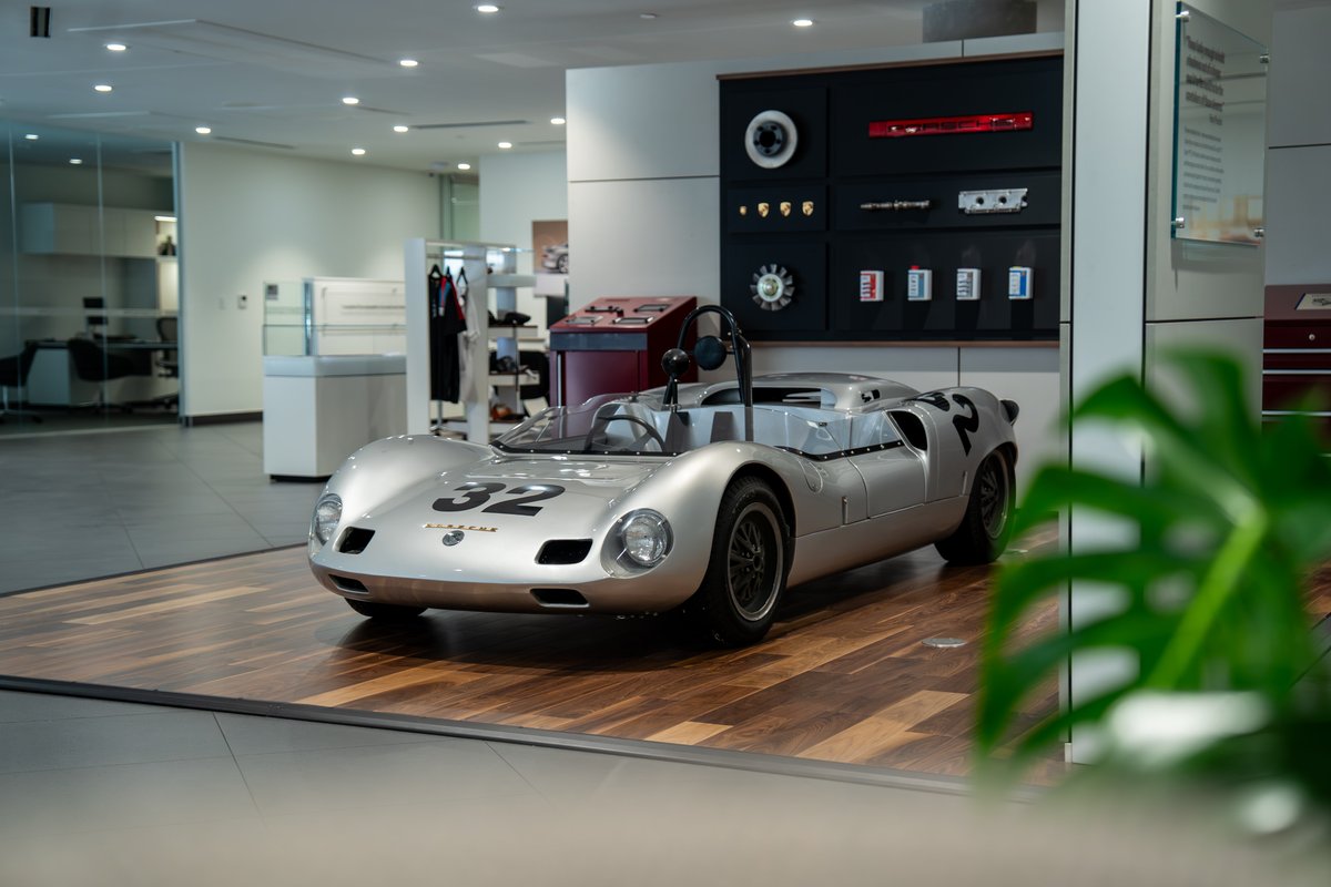 1964 Elva Porsche 4 Cam race car, silver, number 32 livery, classic rims.