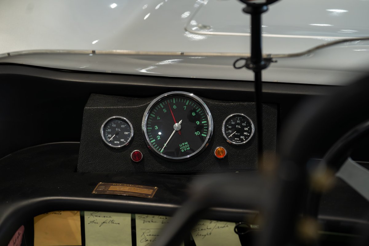1964 Elva Porsche 4-Cam dashboard with tachometer and oil pressure gauges.