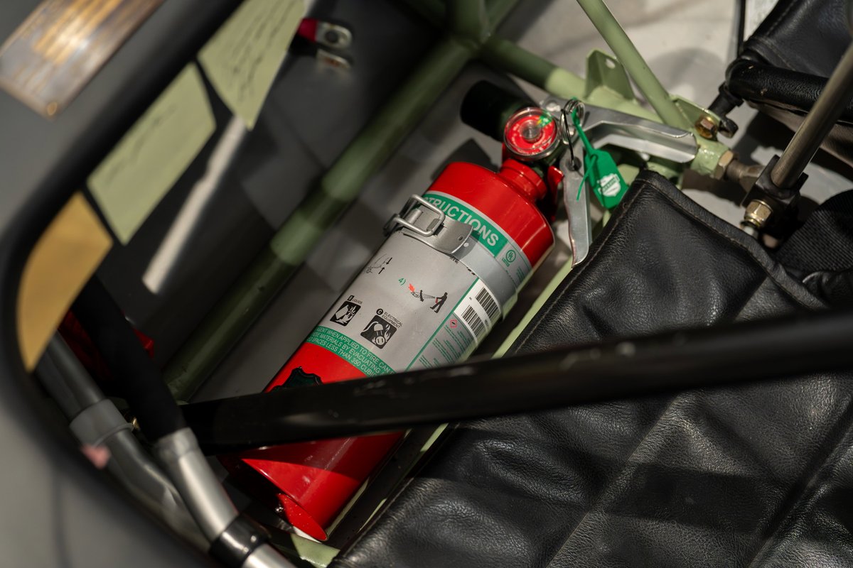 1964 Elva Porsche 4-Cam with red fire extinguisher mounted on roll cage.