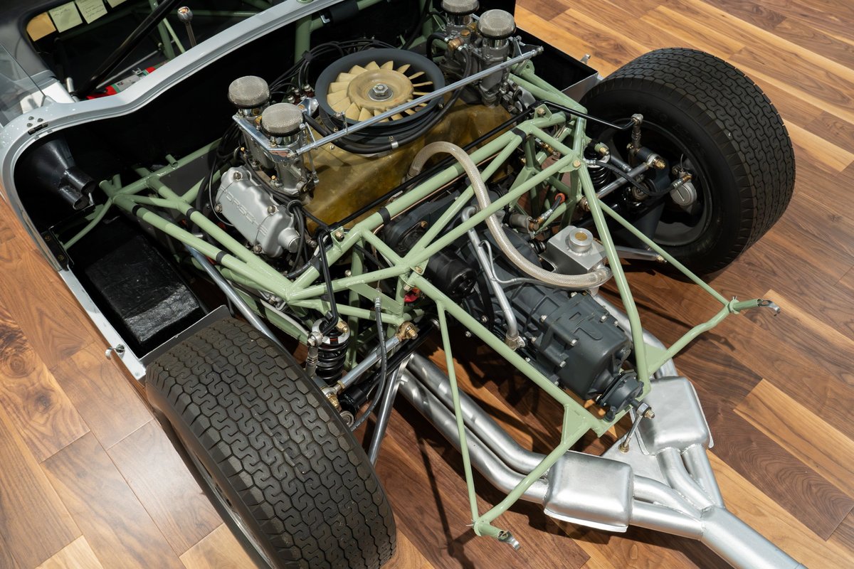 1964 Elva Porsche 4-Cam chassis and engine bay, showing the engine, transmission, and suspension.