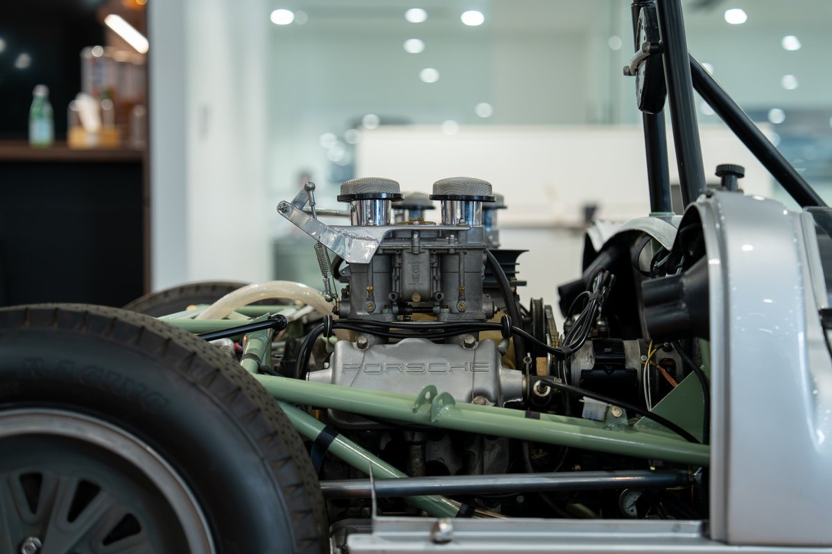 1964 Elva Porsche 4-Cam engine with dual carburetors and silver body trim.