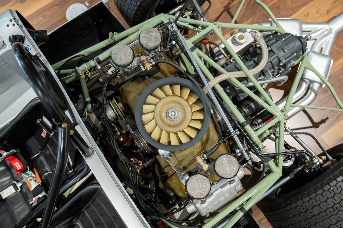 Overhead view of a 1964 Elva Porsche 4-cam engine and chassis with racing seats.