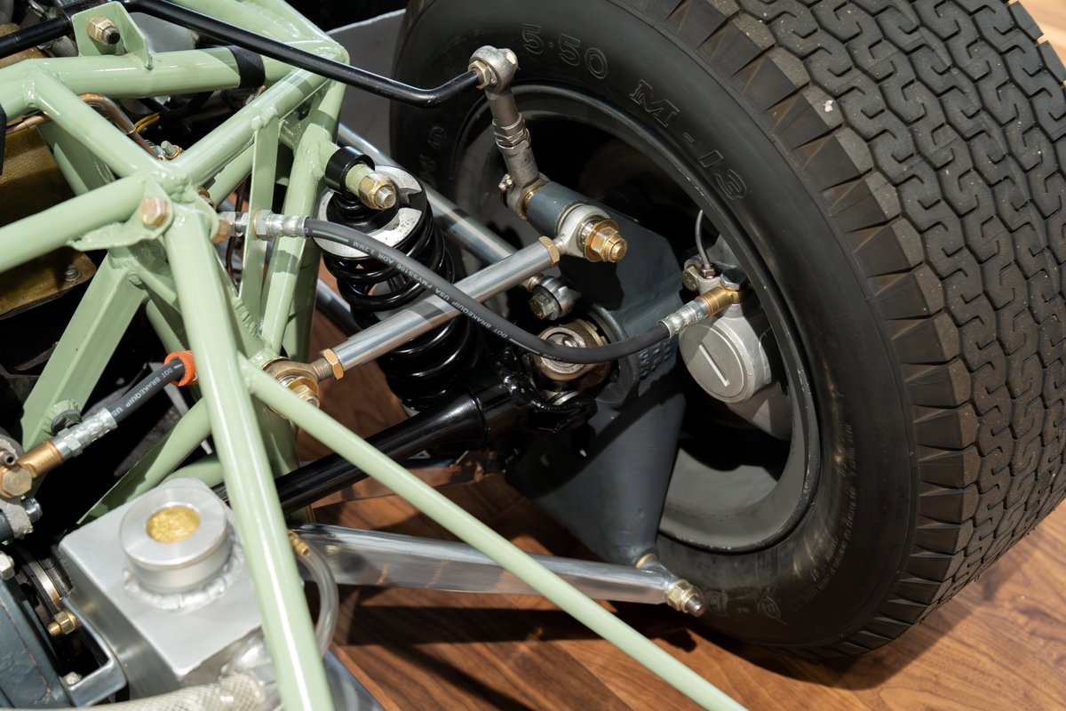 Vintage Elva Porsche 4-cam chassis with racing slick tire and coilover suspension.